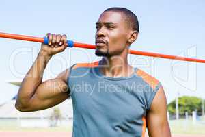 Athlete holding javelin on his shoulder