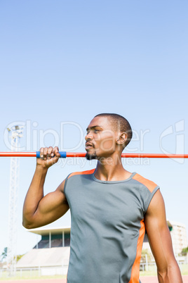 Athlete holding javelin on his shoulder