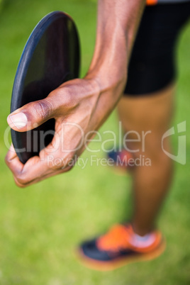 Close-up of athlete holding a discus