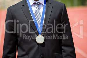 Businessman wearing gold medal