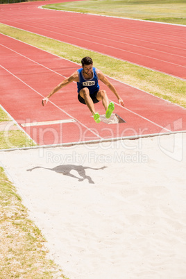 Athlete performing a long jump