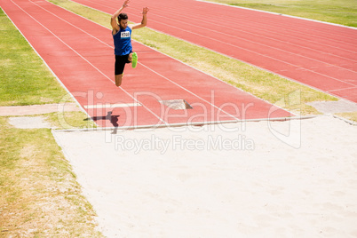 Athlete performing a long jump