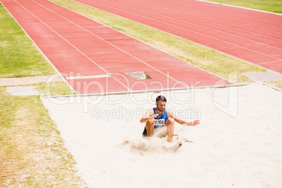 Athlete landing on sandpit