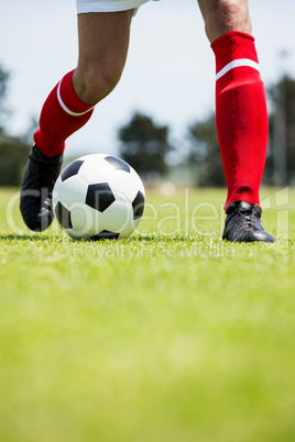 Football player practicing soccer