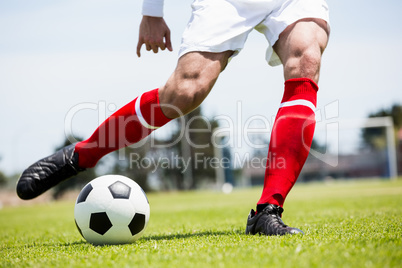 Football player practicing soccer