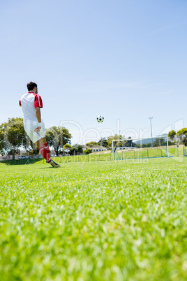 Football player practicing soccer