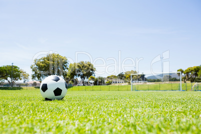Football on green field