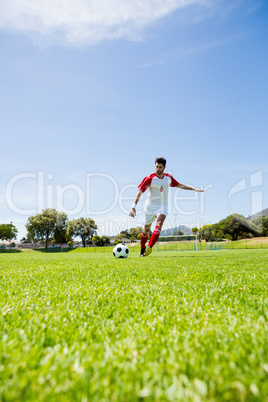 Football player practicing soccer