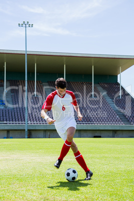 Football player practicing soccer