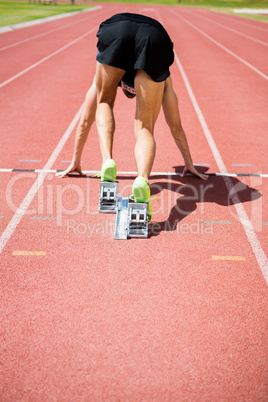 Rear view of an athlete ready to run