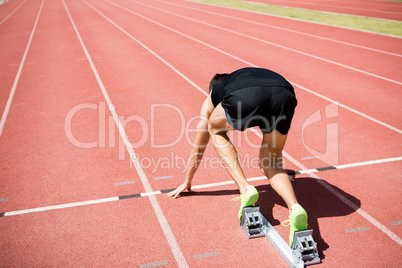 Rear view of an athlete ready to run