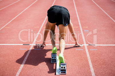 Rear view of an athlete ready to run