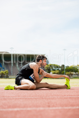 Athlete doing stretching exercise