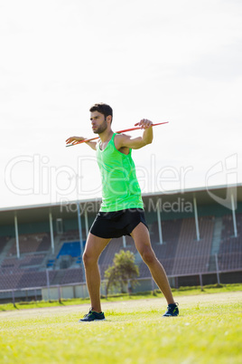 Athlete standing with javelin