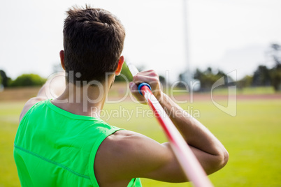 Rear view of an athlete about to throw a javelin