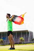 Athlete posing with german flag after victory