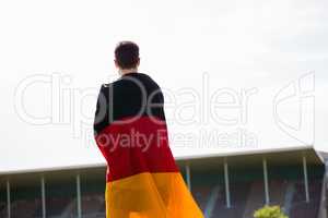 Athlete with german flag wrapped around his body