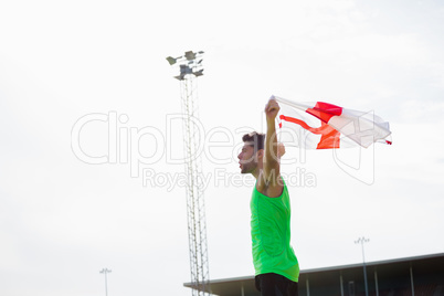 Athlete posing with england flag after victory