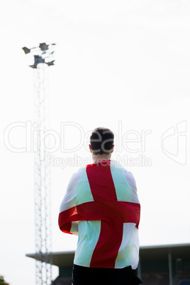 Athlete with england flag wrapped around his body