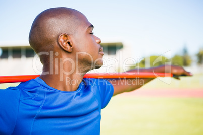 Athlete standing with javelin