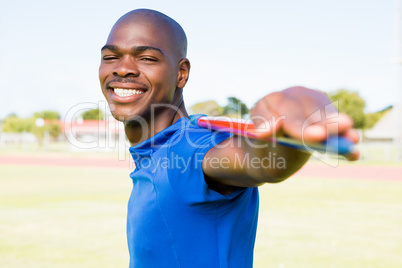 Athlete standing with javelin