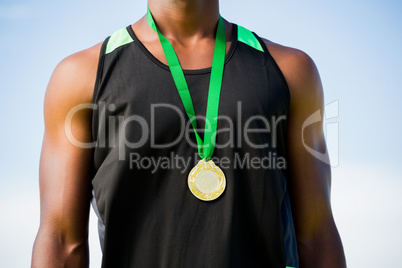 Athlete with gold medal around his neck