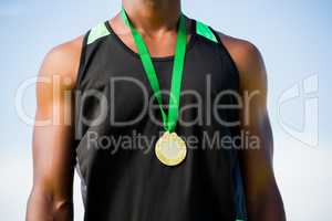 Athlete with gold medal around his neck