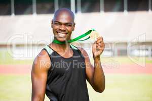 Athlete showing his gold medal