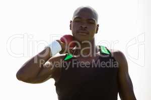 Male athlete preparing to throw shot put ball