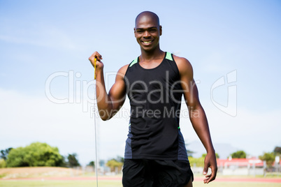 Portrait of athlete holding hammer throw