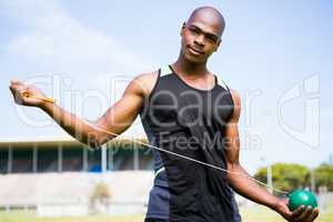 Portrait of athlete holding hammer throw