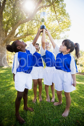 Front view of children soccer team celebrating a victory