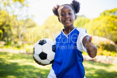 Portrait of girl with thumbs up