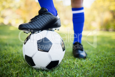 Close up view of balloon under football boots in park