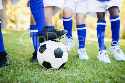 Close up view of balloon under football boots with children play