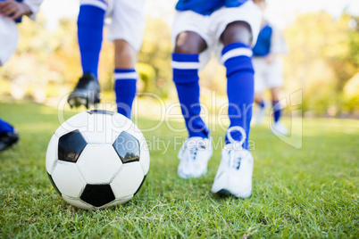 Close up view of children playing soccer