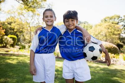 Portrait of two children smiling at camera