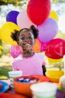 Portrait of cute girl smiling during a birthday party