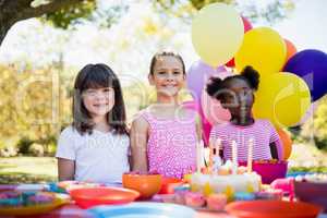 Cute girls smiling and posing during a birthday party