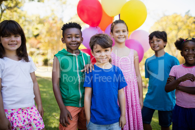 Cute children standing and posing during a birthday party