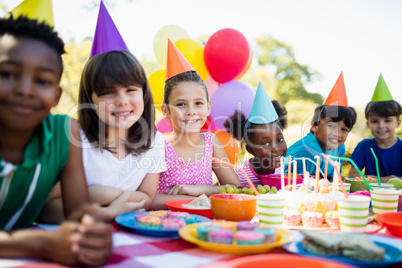 Cute children smiling and posing during a birthday party