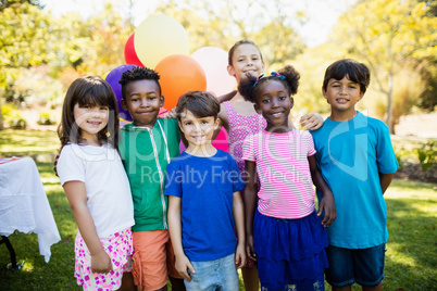 Cute children standing and posing during a birthday party