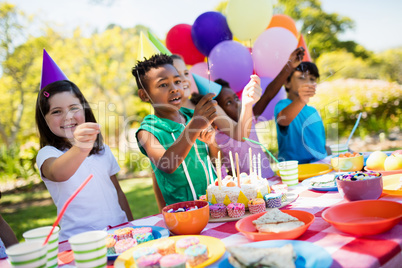 Cute children smiling and having fun during a birthday party
