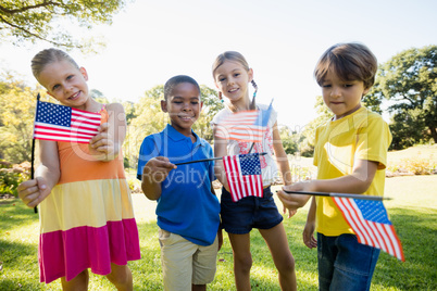 Happy children showing usa flag