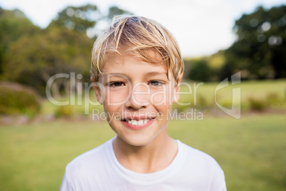 Kid posing at camera during a sunny day