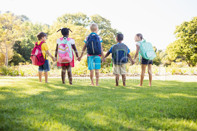 Kids posing together during a sunny day at camera