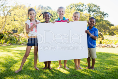 Kids posing together during a sunny day at camera