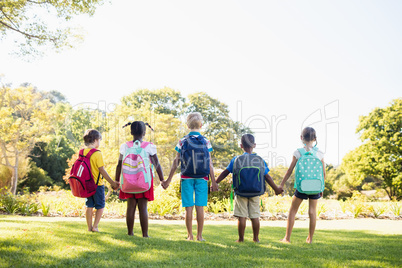 Kids posing together during a sunny day at camera