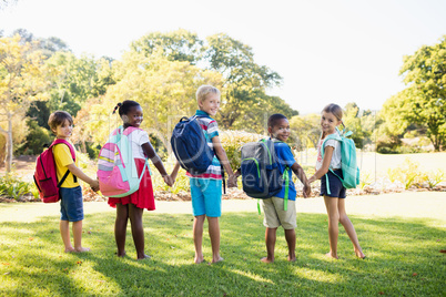 Kids posing together during a sunny day at camera