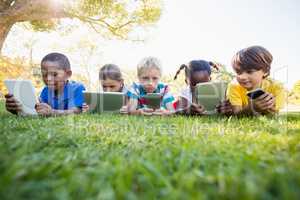 Kids using technology during a sunny day